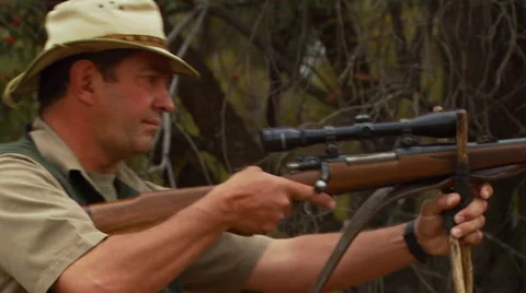 Hunter shooting with long rifle Stock Footage 54591124