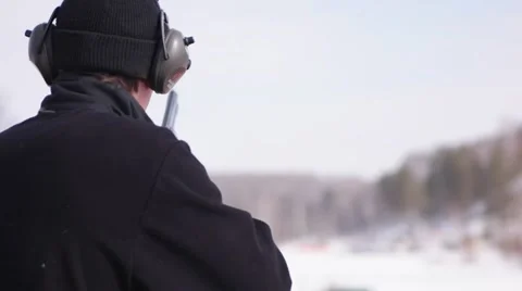 Hunter shooting at a target. Slow motion. Close up. Stock Footage 68289126