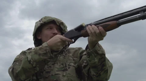Hunter Shoots a Gun Stock Footage 39552686