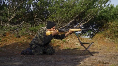 Hunter shoots at the target Stock Footage 117398598