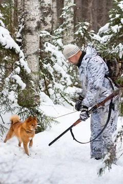 Hunter shows traces to his dog Stock Photos