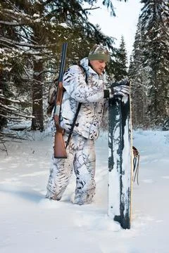 Hunter with skis Stock Photos