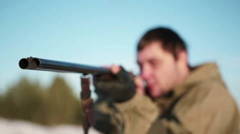 Hunter takes aim and fires at target Stock Footage 45319837