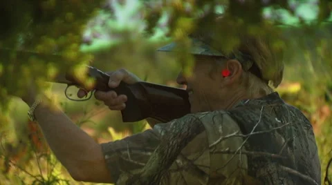 Hunter taking aim and shooting while dove hunting Stock Footage 54591637
