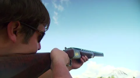 Hunter taking aim and shooting while dove hunting Stock Footage 54591737