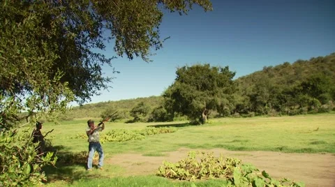 Hunter taking aim and shooting while dove hunting Stock Footage 54591887