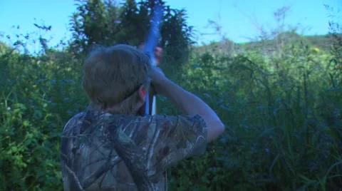 Hunter taking aim on dove while hunting Stock Footage 54591624
