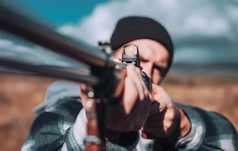 Hunter Target with laser sight. Collimating sight. Hunter with shotgun gun on Stock Photos