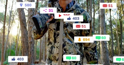 Hunter walking pine path cam rising sparking social metrics holding rifle pink Stock Footage 334184956