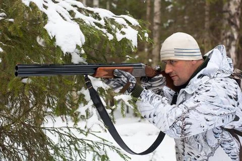 Hunter on winter hunting Stock Photos