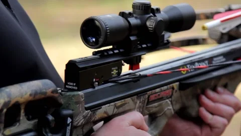 Hunters loading a crossbow Stock Footage 171996582
