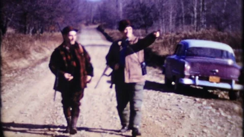 Hunters prepare for a day hunting in the woods 1950 vintage film home movie 4533 Stock Footage