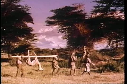 Hunters returning to camp with dinner Stock Footage 11352710