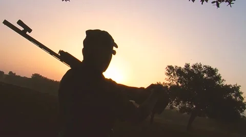 Hunter's silhoutte at the sunset Stock Footage 54737399