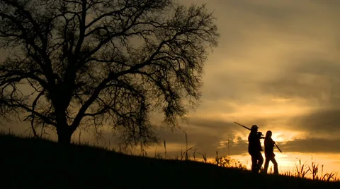 Hunters at sunset 01 HD Video stock 22800097