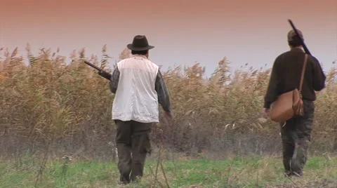 Hunters walking on the field Stock Footage 43623574