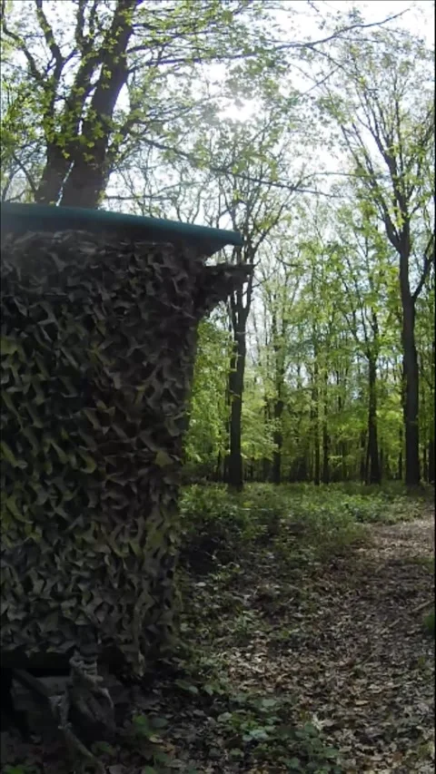 Hunting hide box in camouflage vertical slow motion Stock Footage 333682808