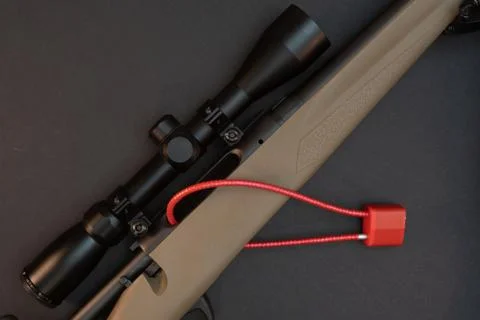 Hunting rifle with cable lock. Stock Photos