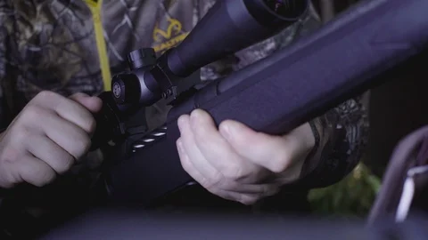 Hunting Rifle - closeup pulling the bolt back - reloading Stock Footage 88165186