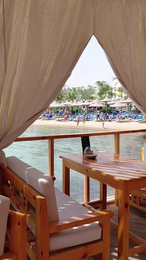 Hurghada, Egypt - May 17 2026: a busy holiday beach Stock Footage 336245503