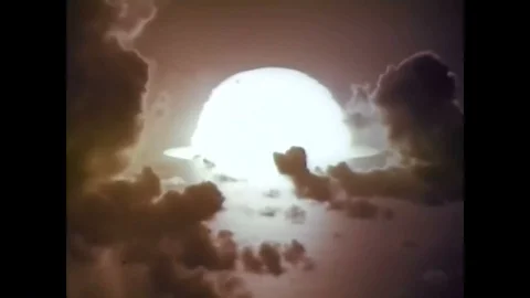 The Huron, Mohawk and Tewa nuclear test shots explode into mushroom clouds in 動画素材 88828313