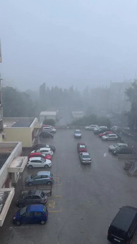 Hurricane Aftermath in Split, Croatia: Heavy Rainfall over Parking Lot Stock Footage 312744386