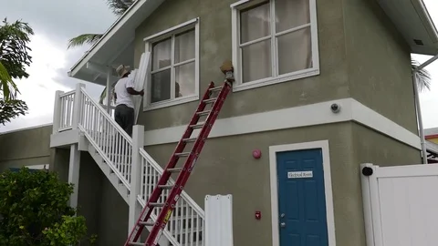 Hurricane approaching - shutters go up! Video stock 73026450