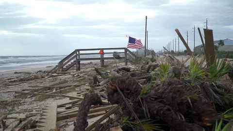 Hurricane debries showing a flag Stock Footage 115375391