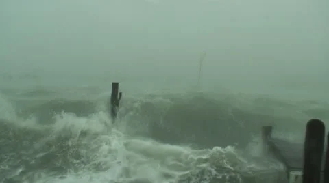 Hurricane Dorian wind, rain, and storm surge pound a dock Stock Footage 12569068