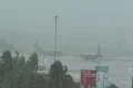 Hurricane Earl - C130 plan awaiting in runway under storm with audio Footage
