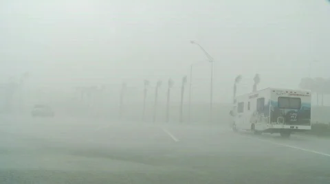 Hurricane force wind and rain lashes parking lot Stock Footage 360590
