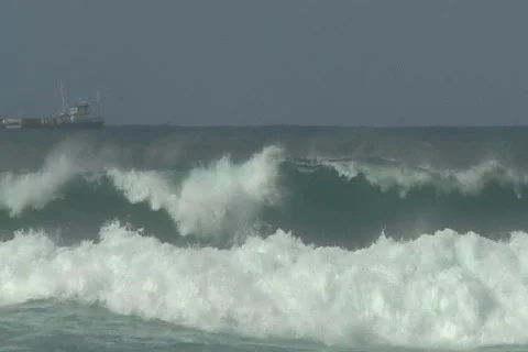 Hurricane Igor - Small Cargo Ship heading to sea 2 Stock Footage 849454
