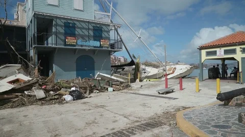 Hurricane Irma aftermath ferry dock in Cruz Bay, beached sailboats Stock Footage 83512036