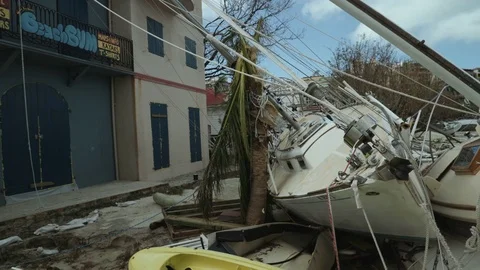 Hurricane Irma aftermath ferry dock in Cruz Bay, beached sailboats Stock Footage 83520255