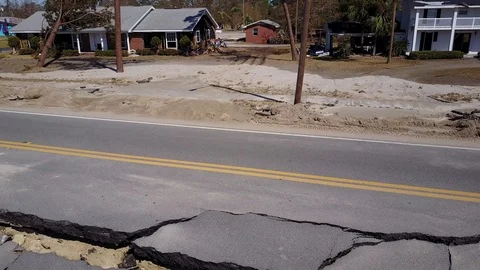 Hurricane Michael Damage Collapsed Road Route US 98 aerial closeup pan Florida Stock Footage 97505814