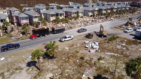 Hurricane Michael Damage Debris Clearing backhoe depart shot Florida Stock Footage 97391795