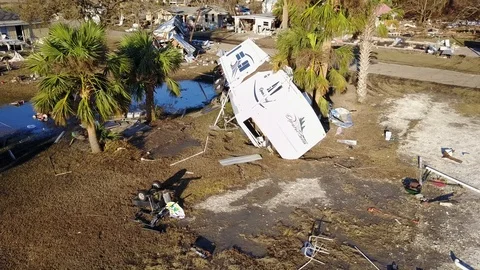 Hurricane Michael Damage Trailers Pushed and Moved off Foundation aerial medium Stock Footage 97426177