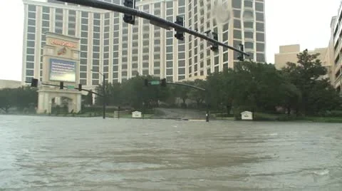 Hurricane storm surge floods an intersection outside the beau rivage casino Stock Footage 12577158