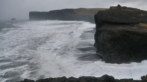 Hurricane Waves During Storm Crash Against Dyrholaey Black Cliffs, Iceland Stock Footage 97394049
