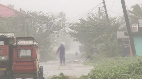 Hurricane Wind And Rain Batters Man And Vehicle Stock Footage 8998005