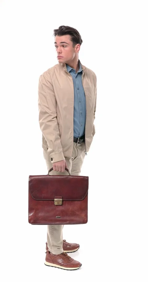 Hurried casual guy with bag checking the time, looking ahead and behind, Stock Footage 304829971