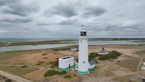 Hurst Point Lighthouse and Hurst Castle from drone over Hurst Spit, Milford on Stock Footage 333346671