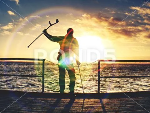 Hurt passenger is waiting for ferry. Empty moring harbor pier, Stock Photos
