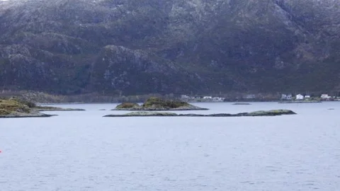 Hurtigruten MS Nordnorge IMO 9107784 passing Herøya, Herøy, Stegleholmen Stock Footage 292642853