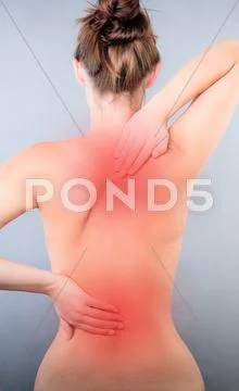Hurting back on stressed female Stock Photos