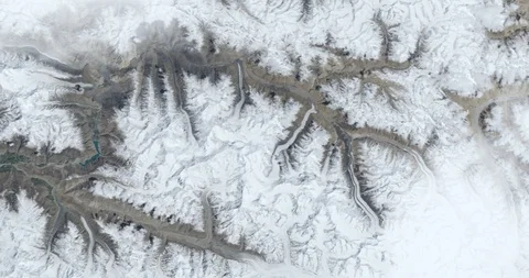 Hurtling earthward, out of control, over Khurdopin mountains, Pakistan Stock Footage 101238384