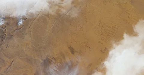 Hurtling earthward, out of control, over desert terrain in Algeria Stock Footage 101246714