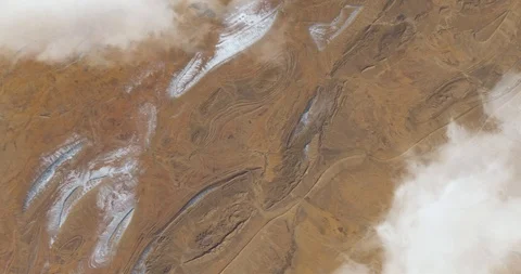 Hurtling earthward, out of control, over desert terrain in Algeria Stock Footage 101246971