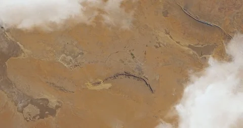 Hurtling earthward, out of control, over desert terrain in Algeria Stock Footage 101247209