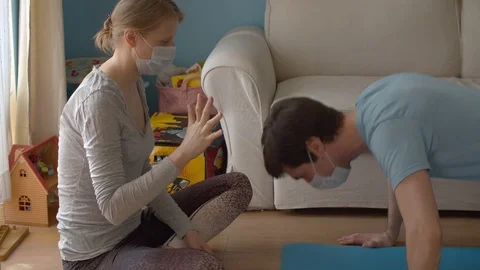 Husband does push-ups and his wife counts Stock Footage 127167075